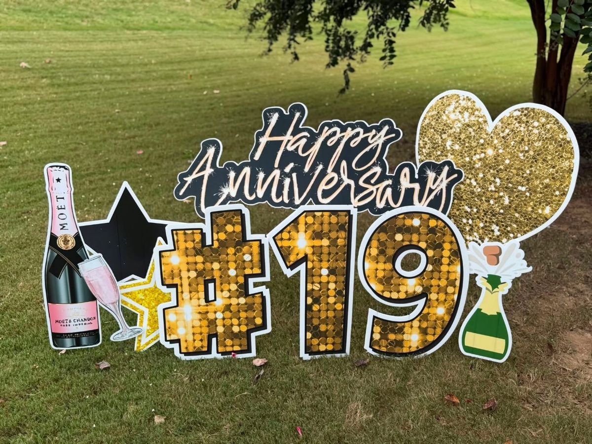 Gold sequin Happy Anniversary #19 display with champagne and a gold heart