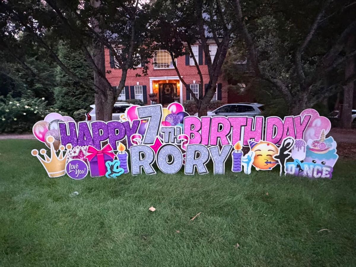 Purple and pink glitter Happy 7th Birthday Rory yard display with crowns and dance decor