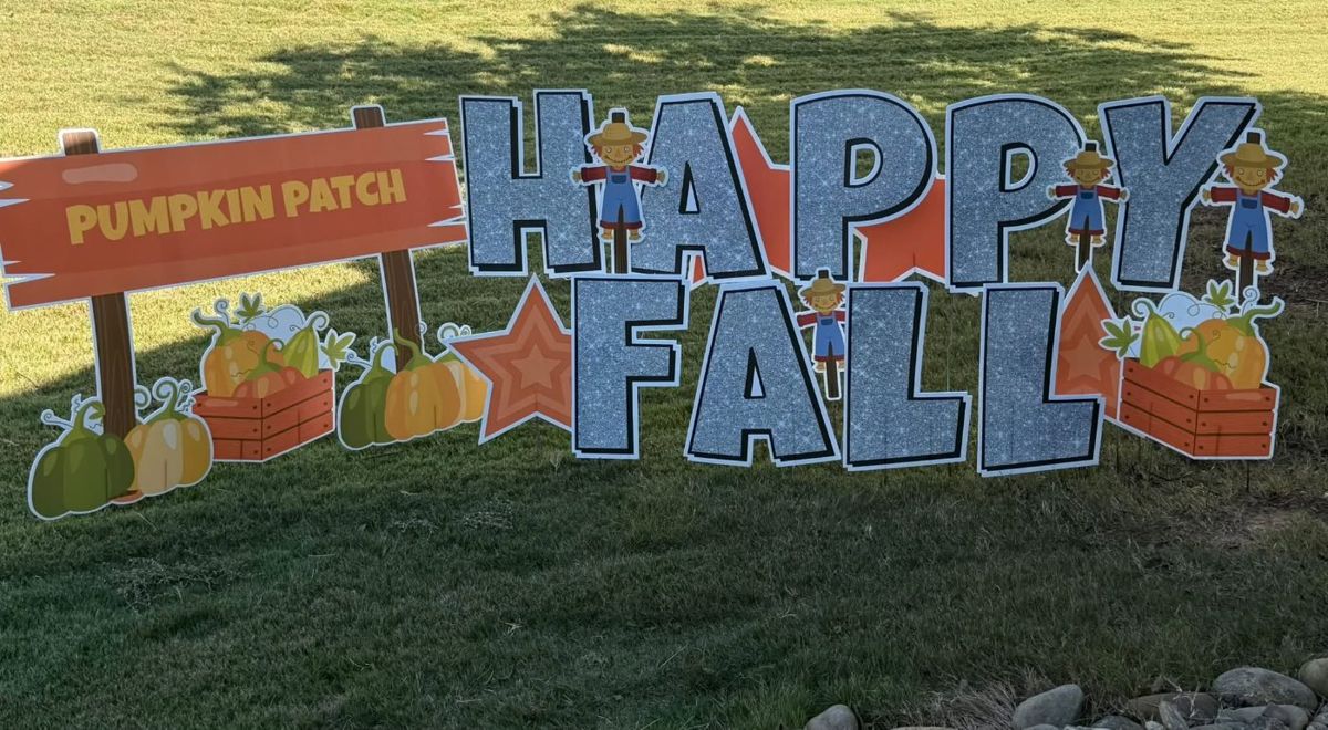 Silver glitter Happy Fall display with pumpkins, scarecrows and a pumpkin patch sign